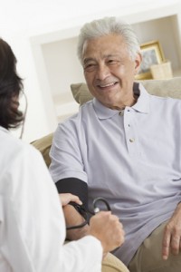 Cheerful Senior Man Having His Blood Pressure Taken